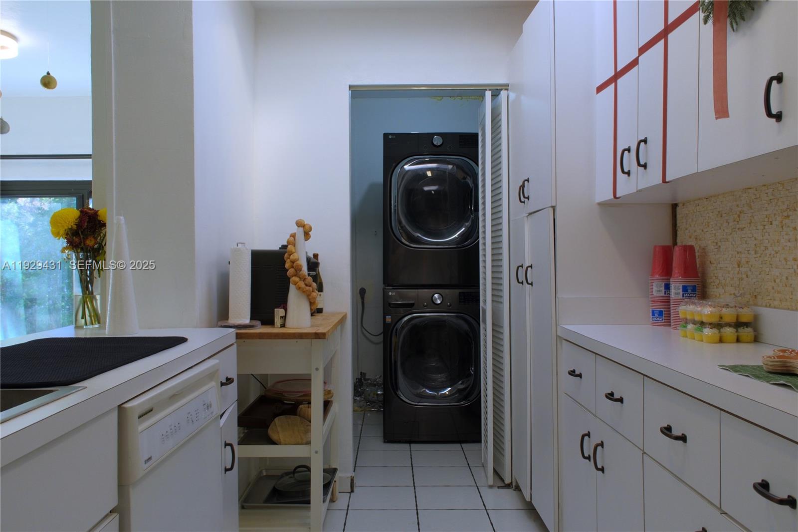 2818 Southwest 19th Street Miami, FL 33145 - Photo 35 of 43 a utility room with sink dryer and washer