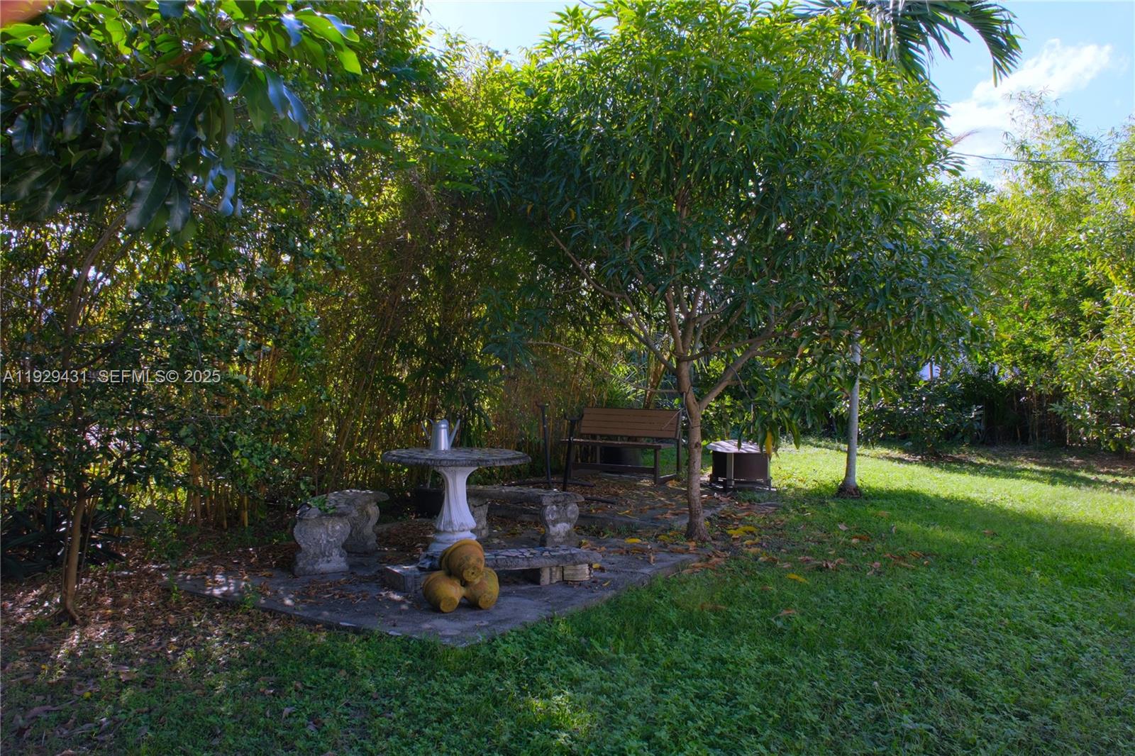 2818 Southwest 19th Street Miami, FL 33145 - Photo 41 of 43 a view of a backyard with wooden fence and a bench