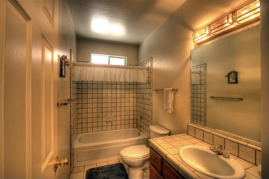 2805 Roop Road Gilroy, CA 95020 - Photo 6 of 20 a bathroom with a sink a toilet and shower