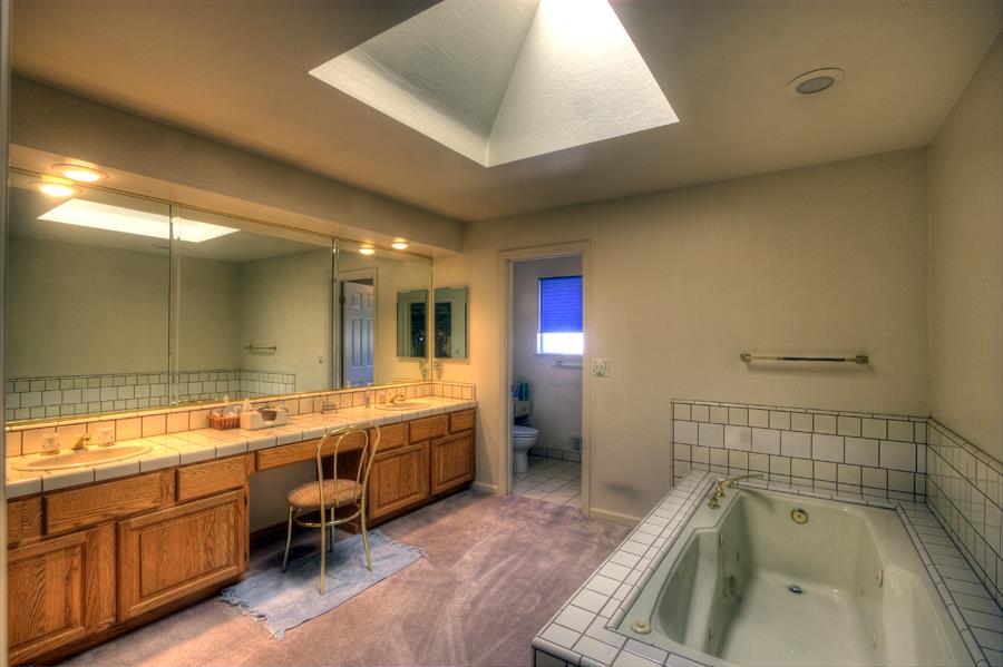2805 Roop Road Gilroy, CA 95020 - Photo 7 of 20 a bathroom with a tub sink and mirror