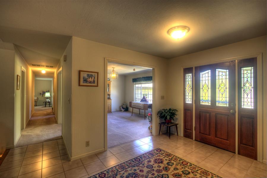 2805 Roop Road Gilroy, CA 95020 - Photo 10 of 20 a view of a hallway with wooden floor and furniture