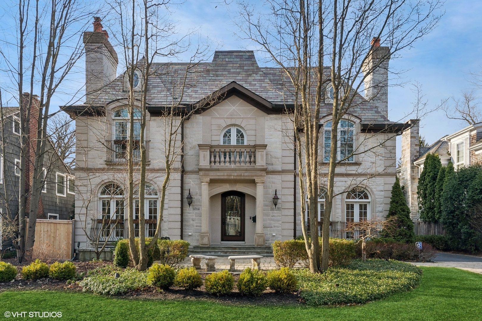 1016 Westmoor Road Winnetka, IL 60093 - Photo 1 of 48 a front view of a house with garden