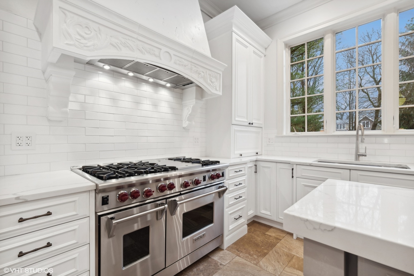 1016 Westmoor Road Winnetka, IL 60093 - Photo 14 of 48 a kitchen with granite countertop a stove and a sink