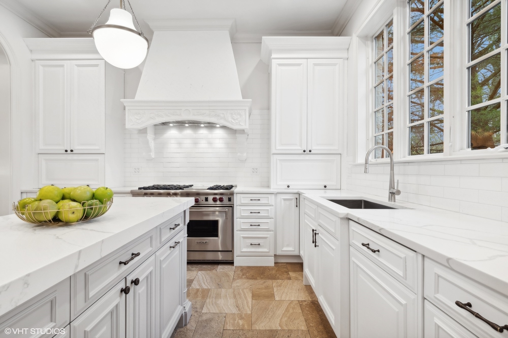 1016 Westmoor Road Winnetka, IL 60093 - Photo 15 of 48 a kitchen with white cabinets and a stove
