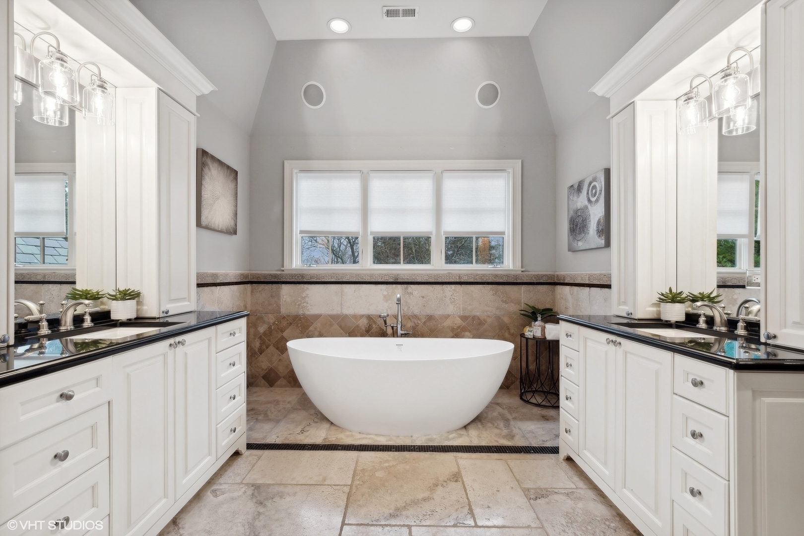 1016 Westmoor Road Winnetka, IL 60093 - Photo 26 of 48 a spacious bathroom with a double vanity sink a mirror a window and a bathtub