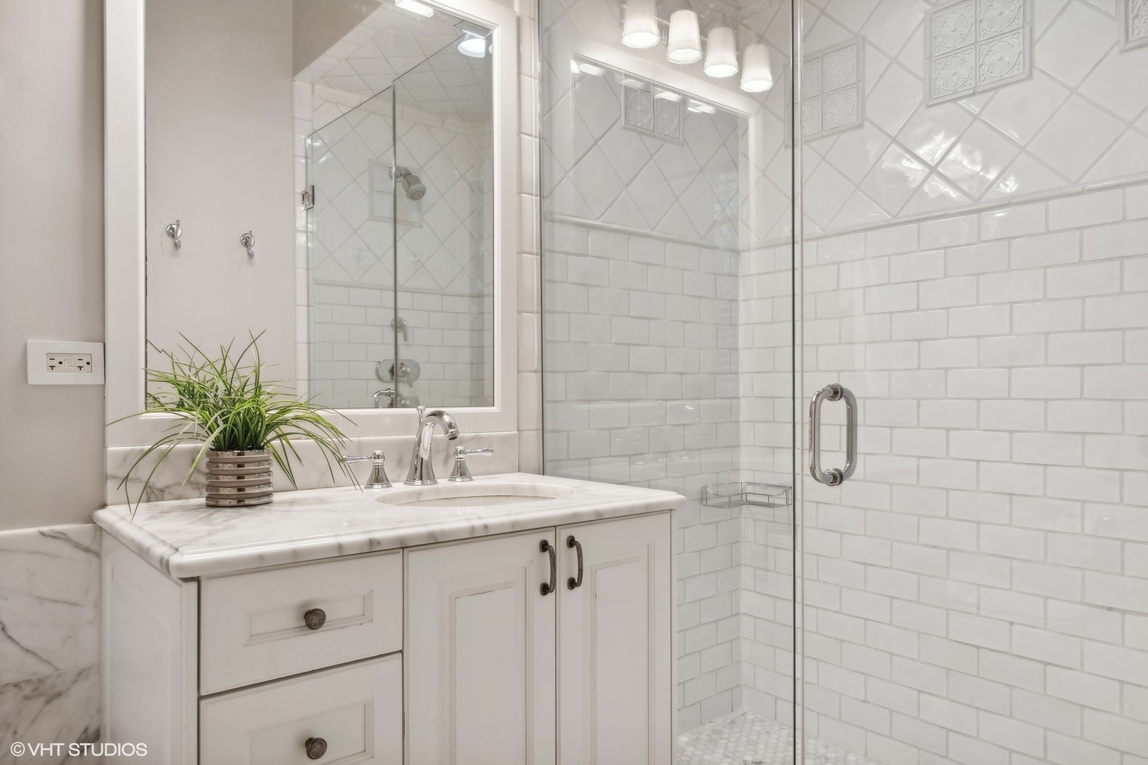 1016 Westmoor Road Winnetka, IL 60093 - Photo 28 of 48 a bathroom with a granite countertop sink a mirror and a shower