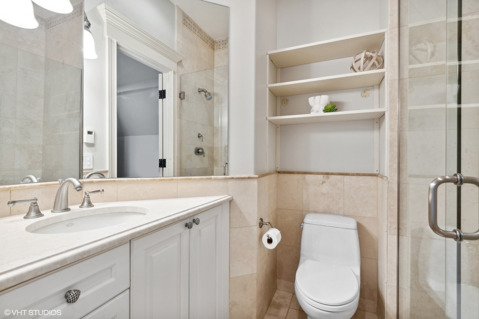 1016 Westmoor Road Winnetka, IL 60093 - Photo 33 of 48 a bathroom with a sink a toilet and shower