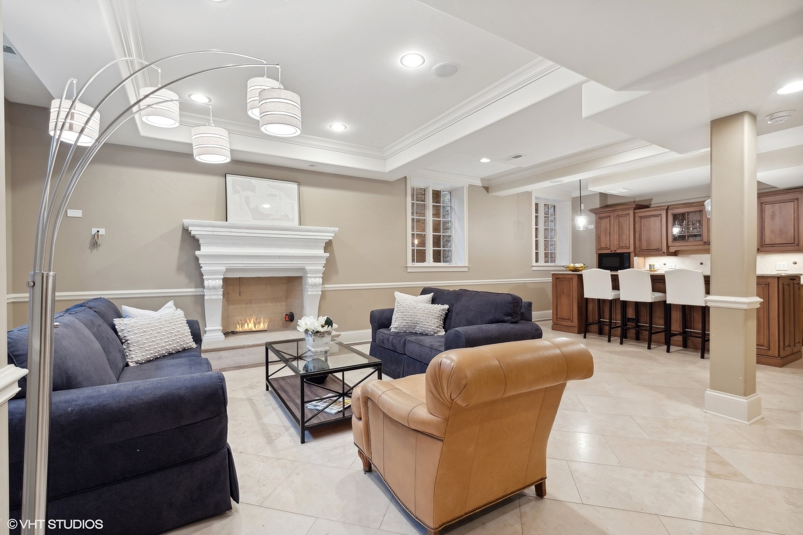 1016 Westmoor Road Winnetka, IL 60093 - Photo 35 of 48 a living room with furniture a fireplace and a chandelier