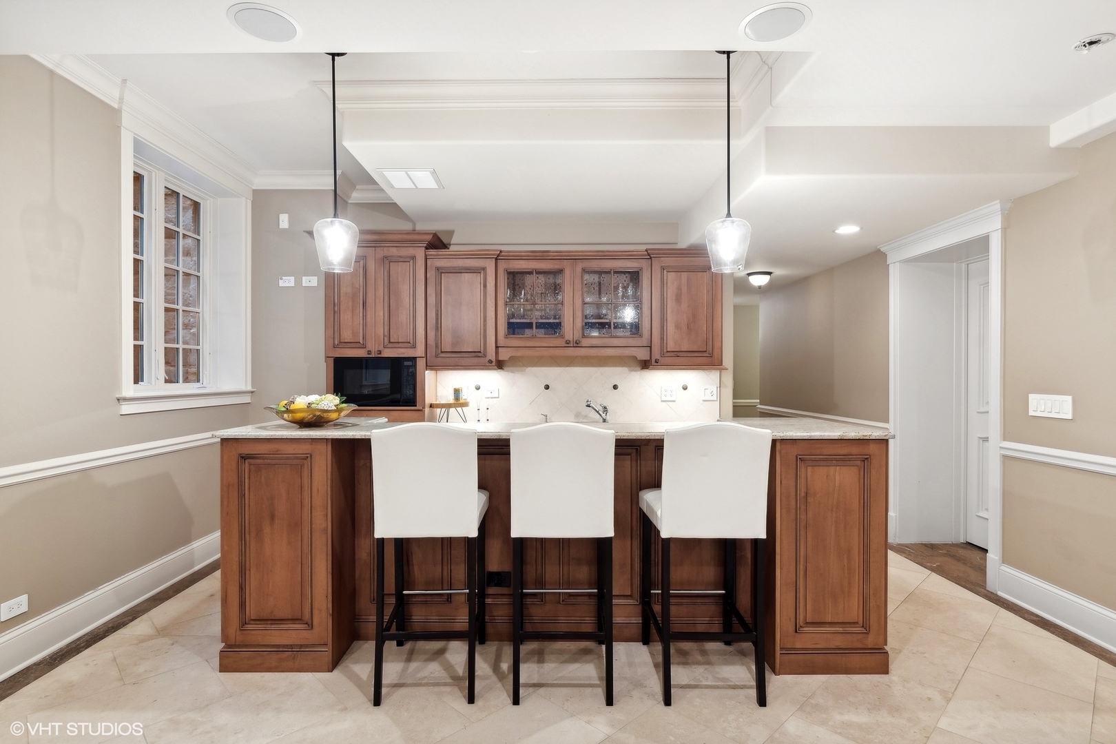 1016 Westmoor Road Winnetka, IL 60093 - Photo 37 of 48 a large kitchen with a table and chairs