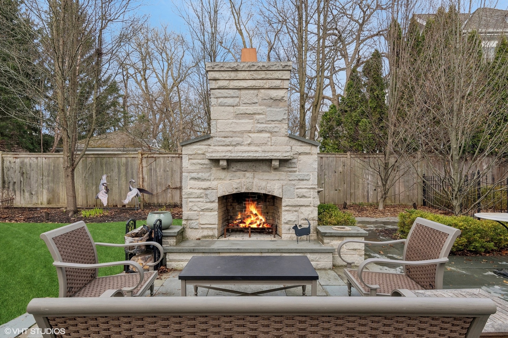 1016 Westmoor Road Winnetka, IL 60093 - Photo 41 of 48 a view of a patio with couches chairs and a fire pit
