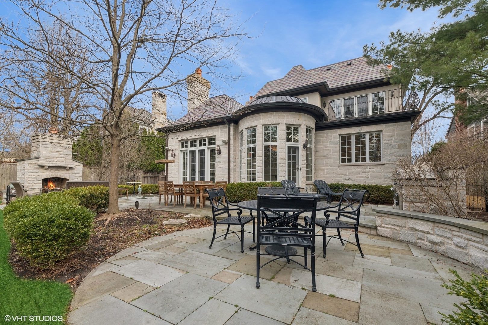 1016 Westmoor Road Winnetka, IL 60093 - Photo 45 of 48 a view of a building with a dining table and chairs