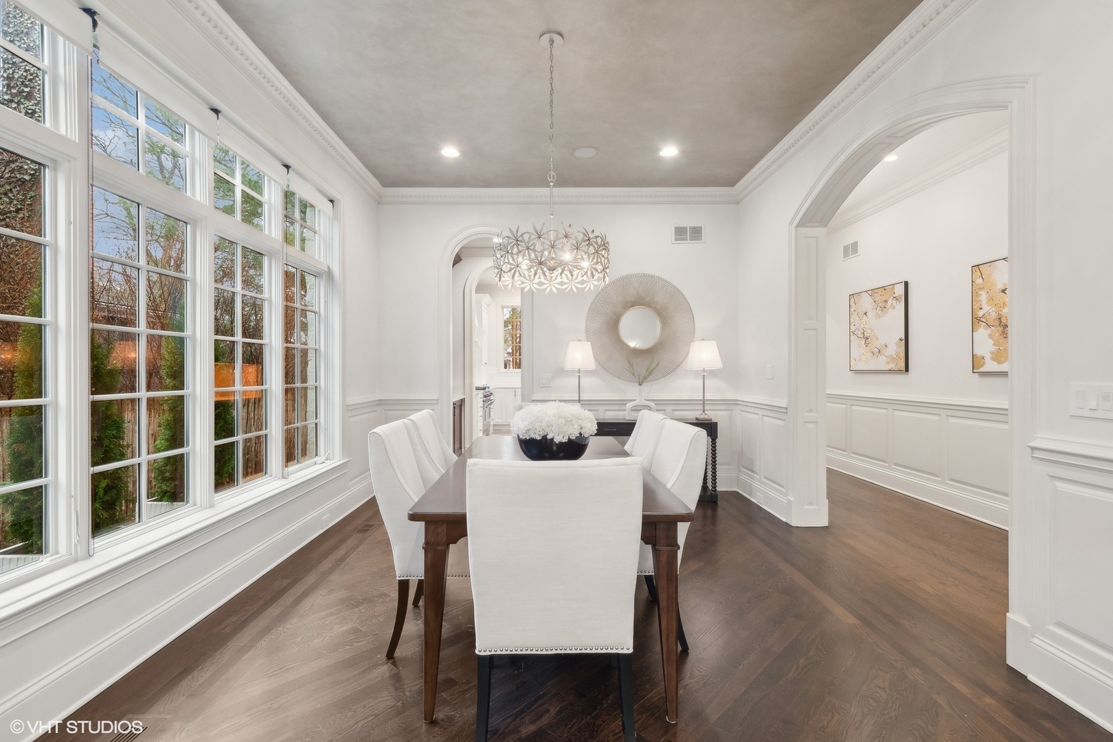 1016 Westmoor Road Winnetka, IL 60093 - Photo 7 of 48 a view of a dining room with furniture a potted plant and wooden floor