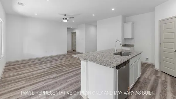 a kitchen with a sink and cabinets