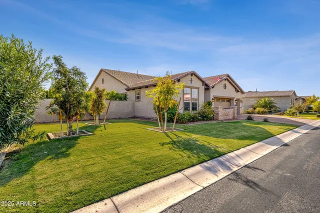 a large kitchen with lots of counter space dining table and chairs