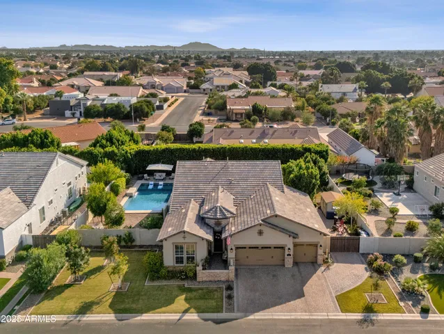 a living room with furniture kitchen view and a window