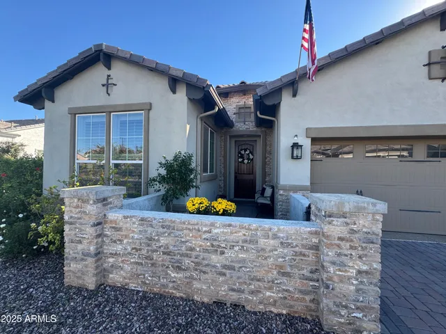 a white bath tub sitting next to a bathroom sink