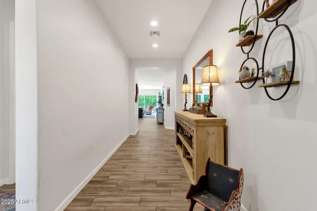a white kitchen with a stove a sink and a refrigerator