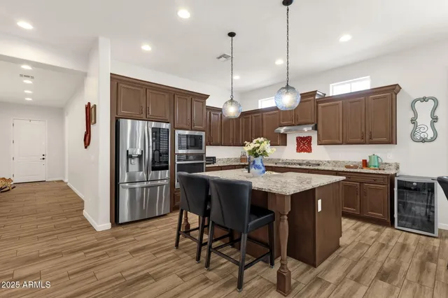 a bathroom with a double vanity sink mirror and shower