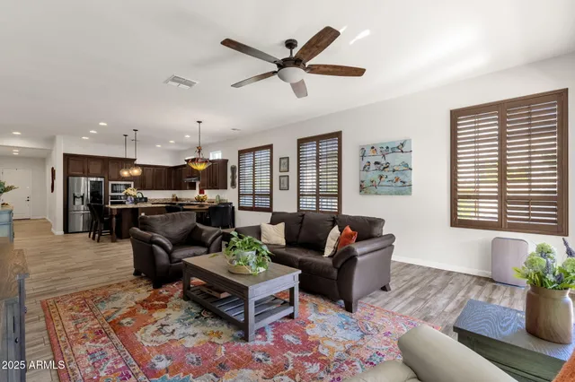 a view of a patio with a table and chairs and potted plants
