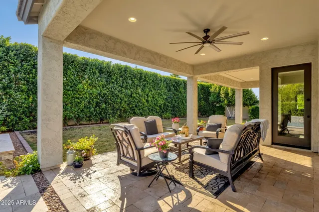 a view of a house with a large window and a yard