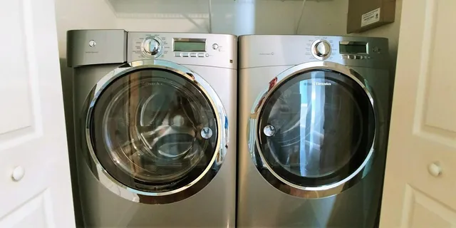 a utility room with dryer and washer
