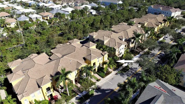 an aerial view of residential houses with outdoor space