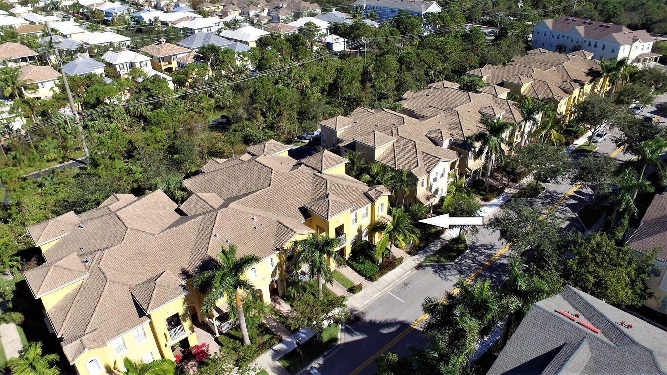 127 Seagrape Drive, Unit 201 Jupiter, FL 33458 - Photo 2 of 17 an aerial view of residential houses with outdoor space