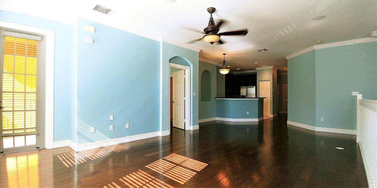 127 Seagrape Drive, Unit 201 Jupiter, FL 33458 - Photo 5 of 17 a view of a room with a window and wooden floor