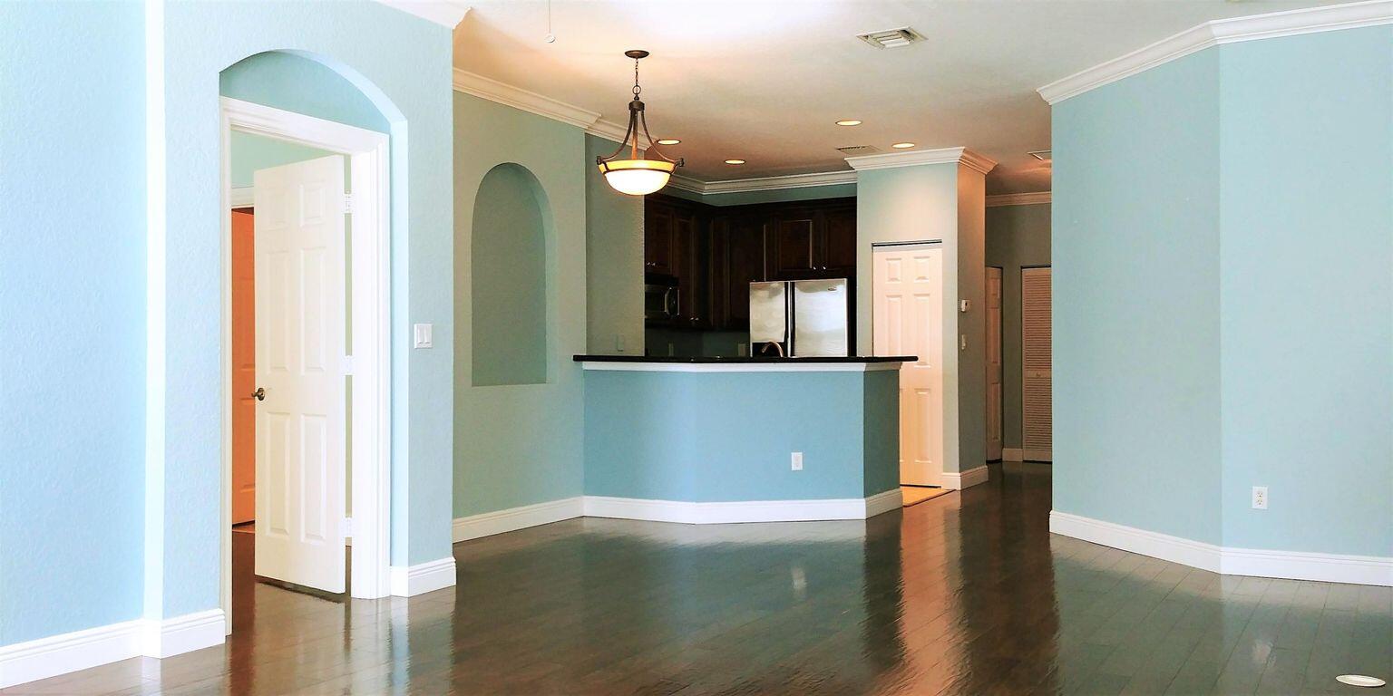 127 Seagrape Drive, Unit 201 Jupiter, FL 33458 - Photo 8 of 17 a view of a hallway with wooden floor