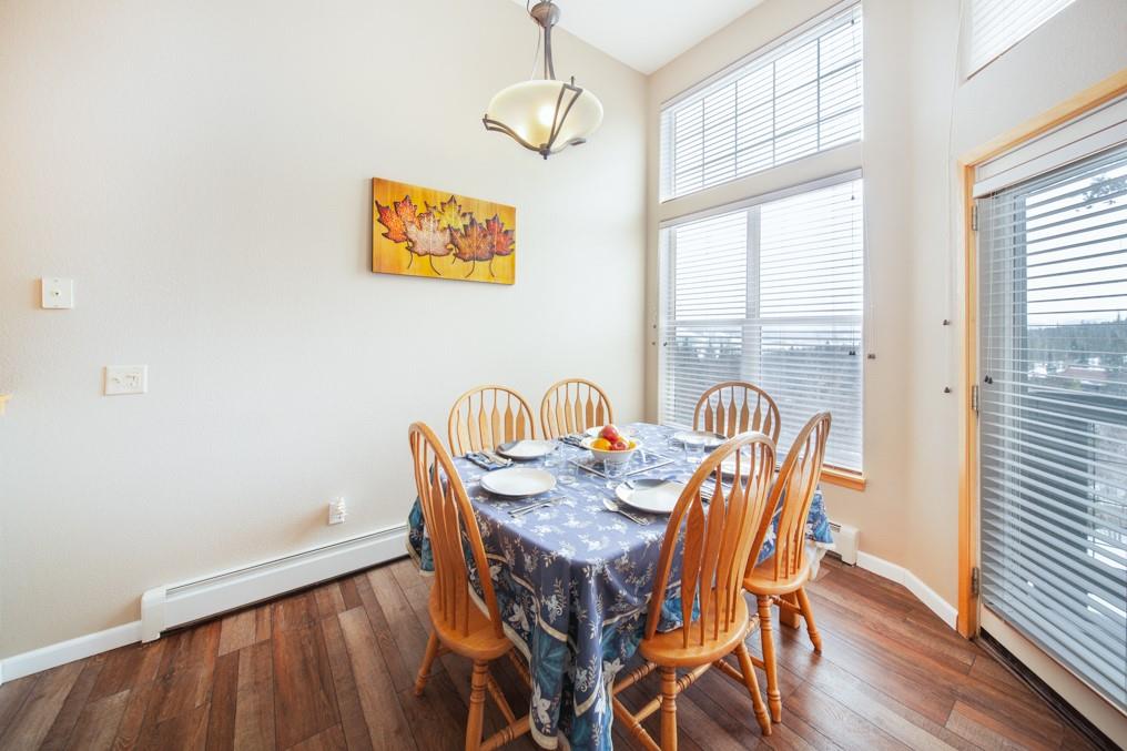91199 Ryan Gulch Road, Unit A5 Silverthorne, CO 80498 - Photo 2 of 31 a view of a dining room with furniture window and wooden floor