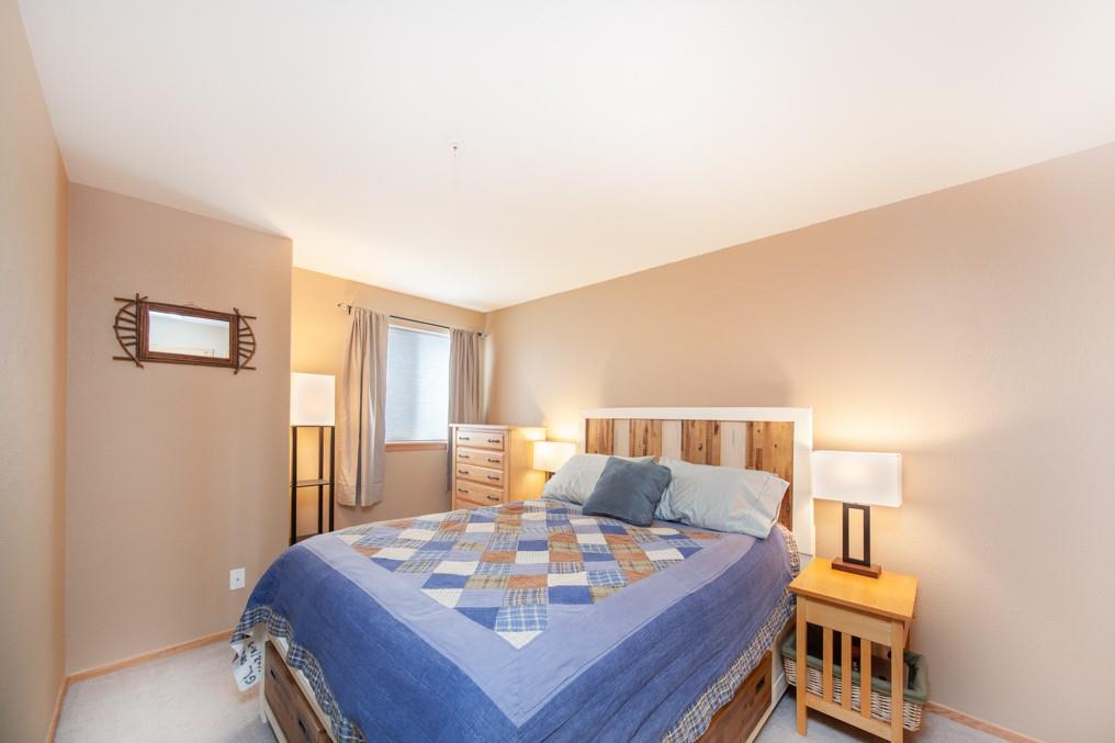 91199 Ryan Gulch Road, Unit A5 Silverthorne, CO 80498 - Photo 11 of 31 a living room with furniture and a table