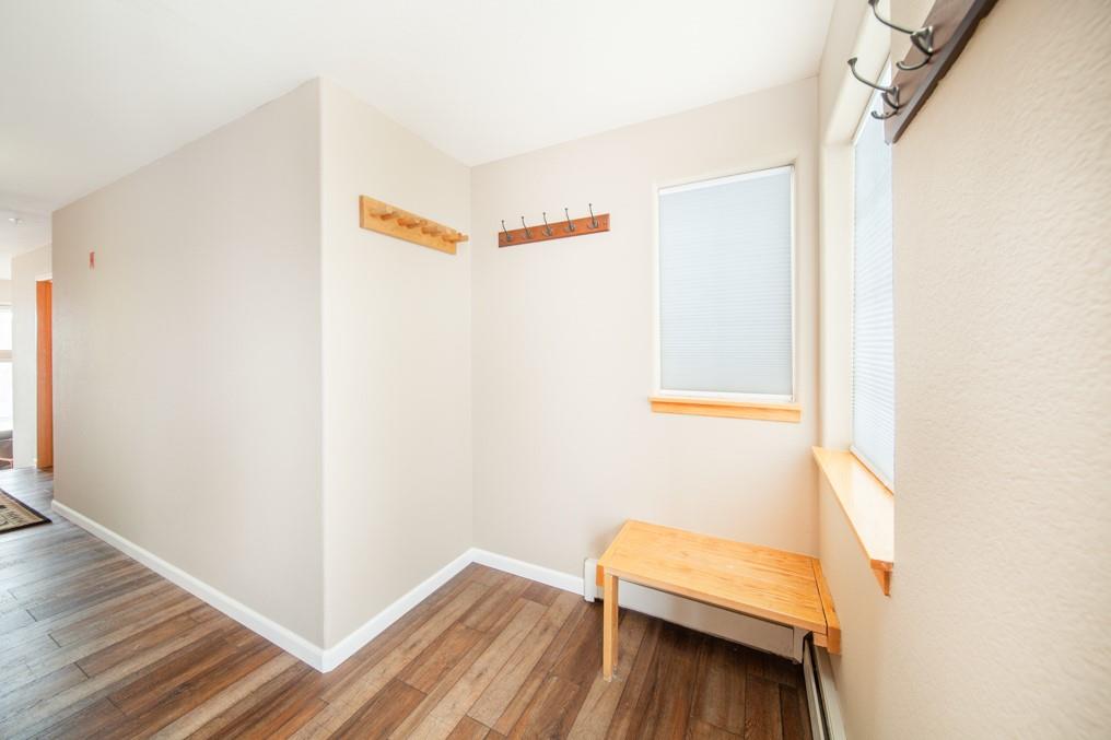 91199 Ryan Gulch Road, Unit A5 Silverthorne, CO 80498 - Photo 13 of 31 a view of room with wooden floor and stairs