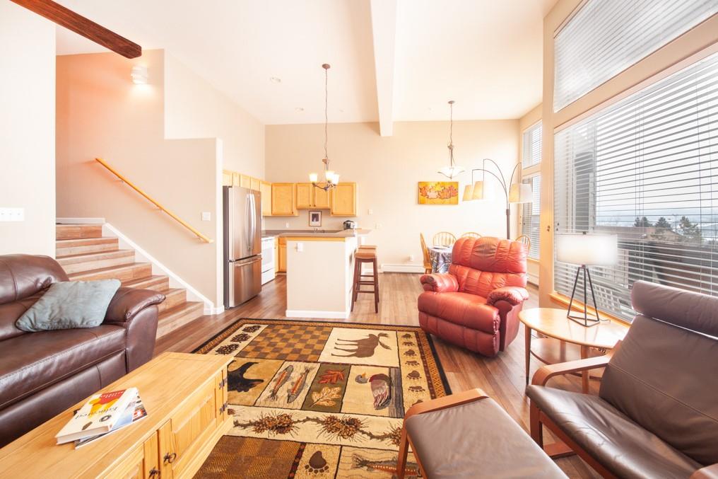 91199 Ryan Gulch Road, Unit A5 Silverthorne, CO 80498 - Photo 5 of 31 a living room with furniture and a rug