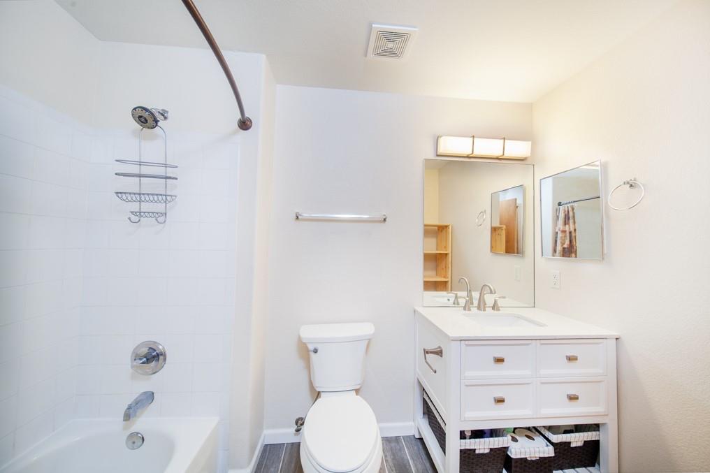 91199 Ryan Gulch Road, Unit A5 Silverthorne, CO 80498 - Photo 9 of 31 a bathroom with a sink a toilet and shower