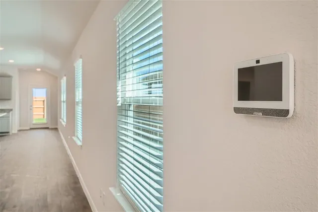 a view of a room with a projector and stairs