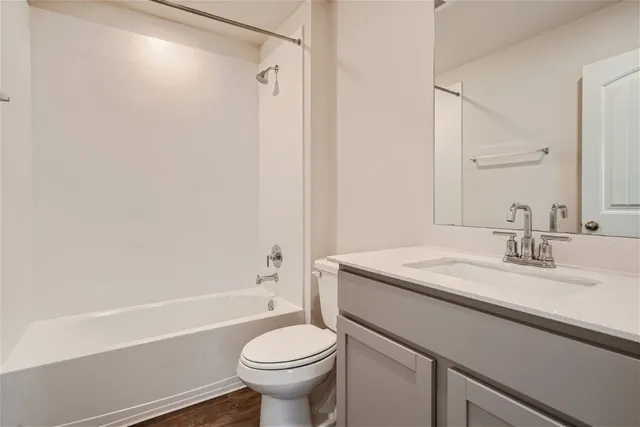 a bathroom with a sink a toilet and a bathtub