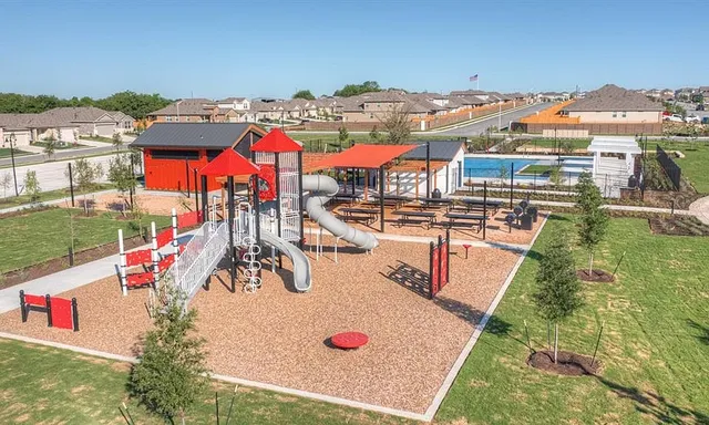an aerial view of residential houses and outdoor space