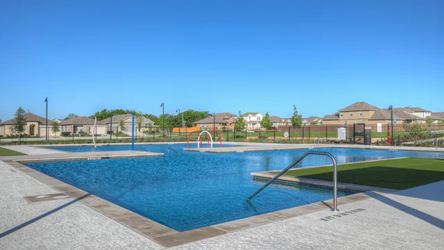 a view of swimming pool with outdoor seating and yard