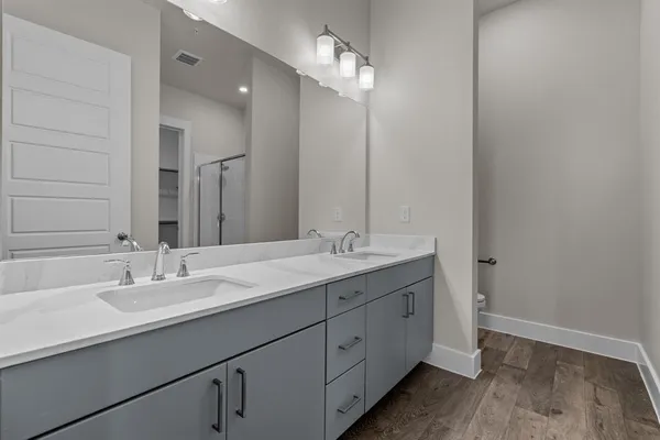 a bathroom with a tub and shower