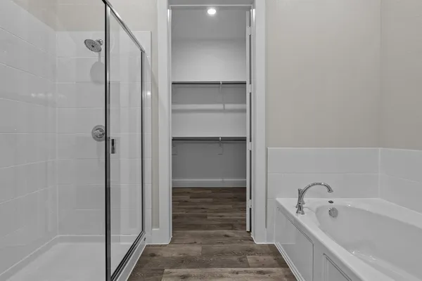 a bathroom with a glass shower door