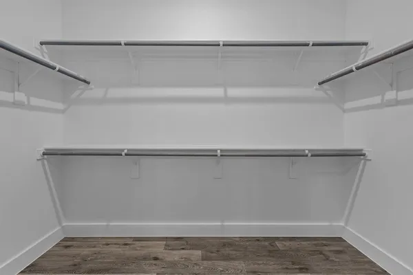 a view of an empty walk in closet