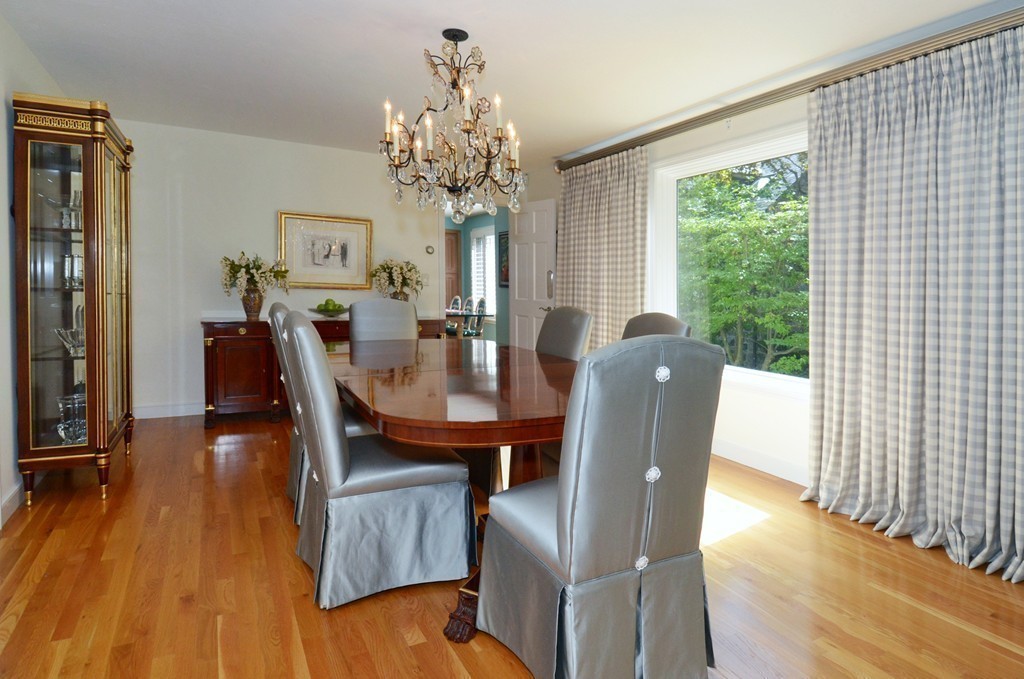 151 Country Club Road Newton, MA 02459 - Photo 13 of 30 a view of a dining room with furniture a chandelier and wooden floor