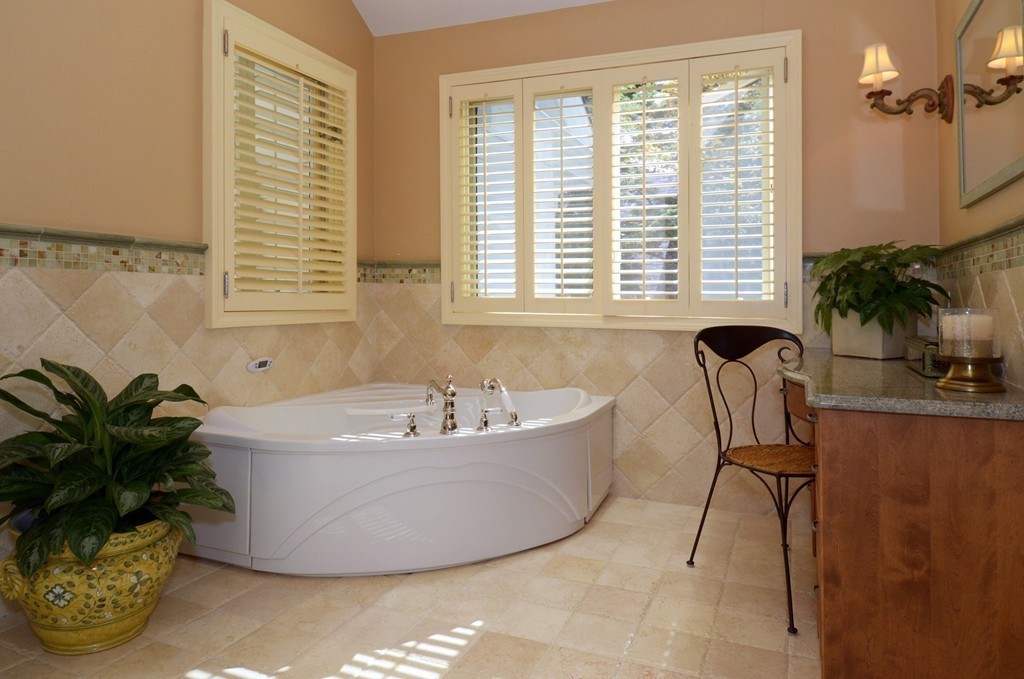 151 Country Club Road Newton, MA 02459 - Photo 23 of 30 a bath tub sitting in a bathroom next to a window
