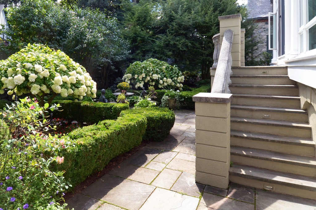 151 Country Club Road Newton, MA 02459 - Photo 3 of 30 a view of a pathway with flower plants