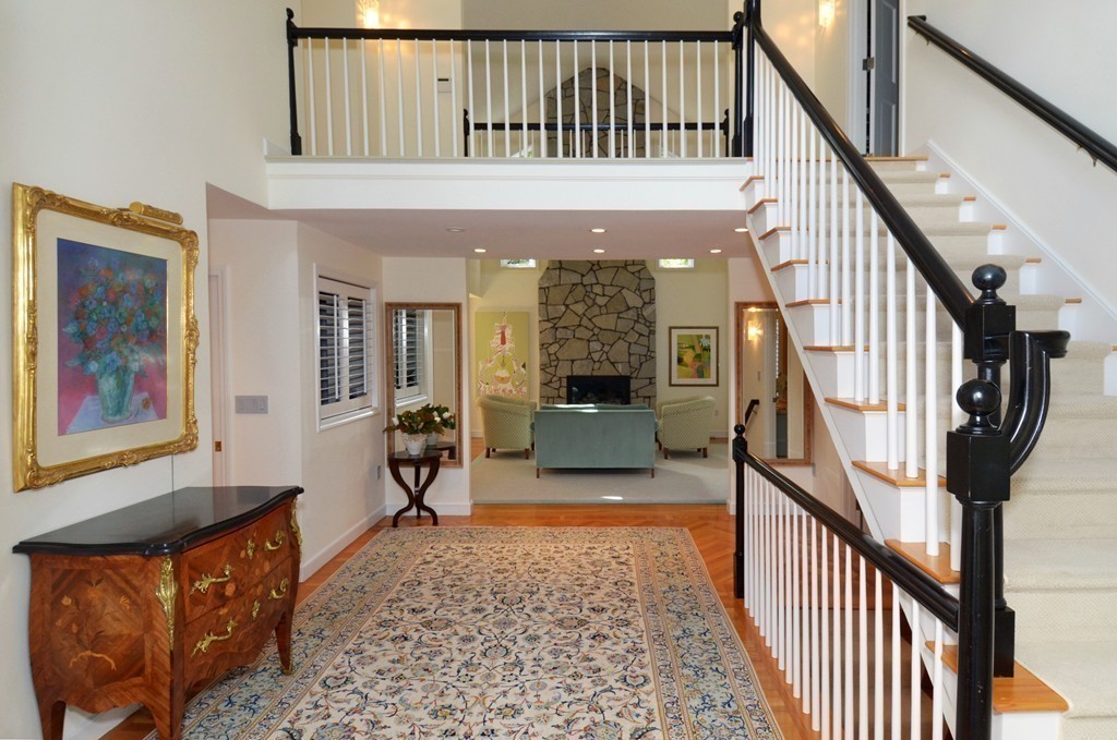 151 Country Club Road Newton, MA 02459 - Photo 10 of 30 a view of staircase with furniture and a chandelier