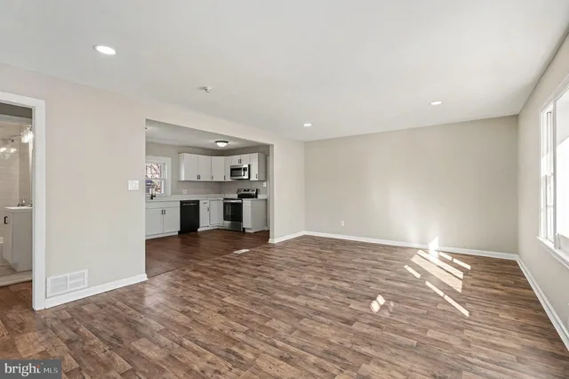 a view of a kitchen with a sink and a stove top oven