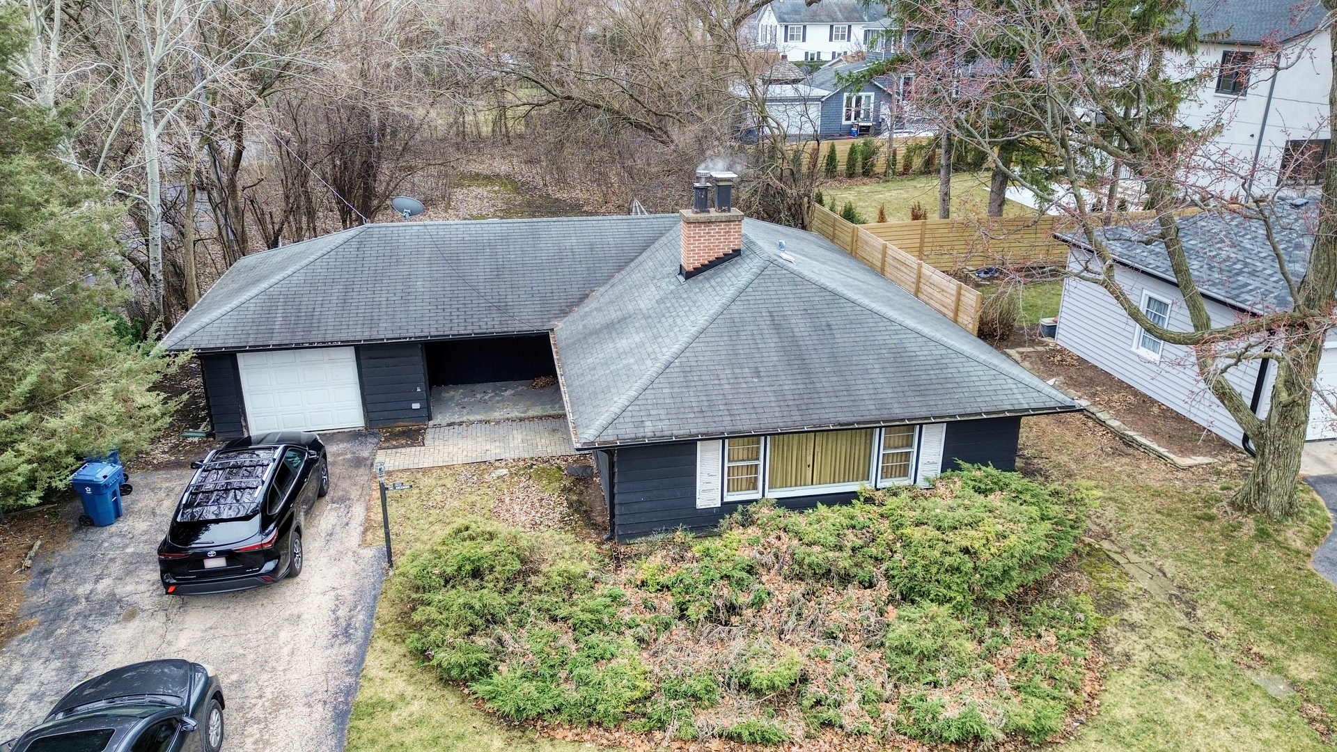 270 East St Charles Road Elmhurst, IL 60126 - Photo 9 of 22 a aerial view of a house with table and chairs under an umbrella