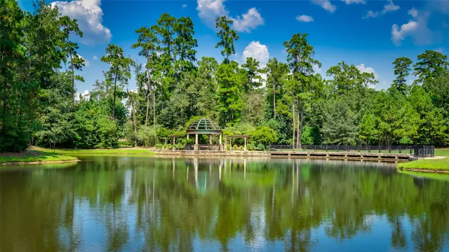a view of a lake with a house in the background