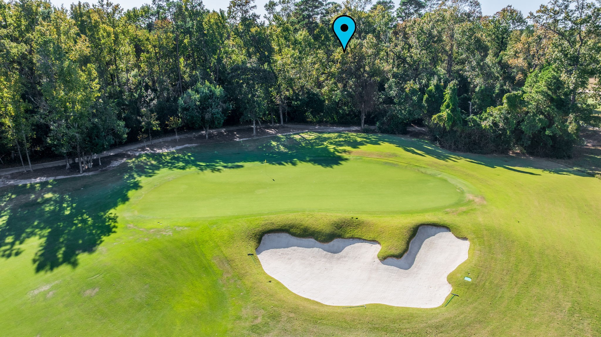 75 Mediterra Way Spring, TX 77389 - Photo 6 of 23 a view of a swimming pool in he middle of the green