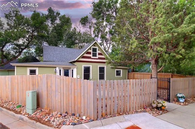 a house with trees in the background